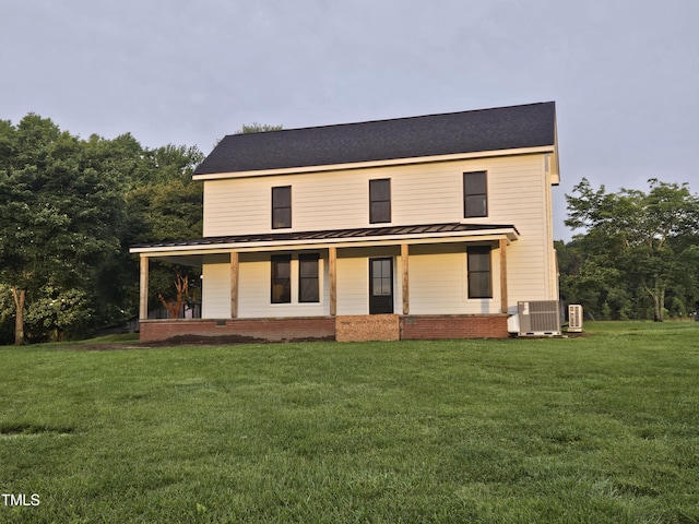 8365 Aaron Creek Church Rd, Oxford, NC 27565 - view of front of property with a standing seam roof, a porch, and a front lawn