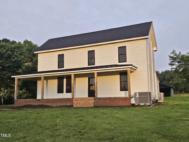 8365 Aaron Creek Church Rd, Oxford, NC 27565 - back of house featuring central air condition unit, a lawn, and covered porch