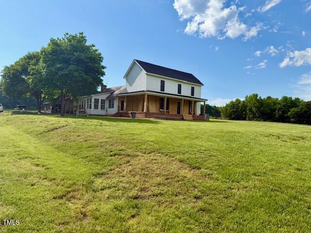 8365 Aaron Creek Church Rd, Oxford, NC 27565 - back of house featuring a yard and a porch