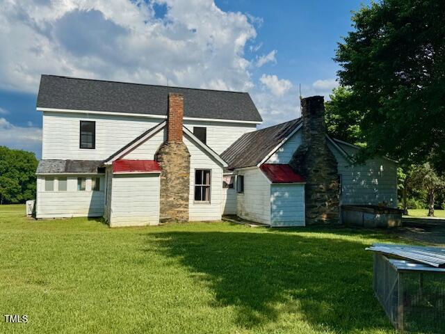 8365 Aaron Creek Church Rd, Oxford, NC 27565 - back of property featuring a chimney and a lawn