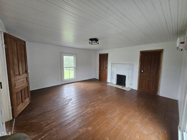 8365 Aaron Creek Church Rd, Oxford, NC 27565 - unfurnished living room featuring hardwood / wood-style flooring, a fireplace with flush hearth, and a wall mounted air conditioner