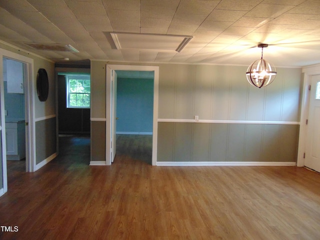 4324 Webbs Chapel Rd, Macclesfield, NC 27852 - empty room with wood finished floors, a chandelier, and baseboards