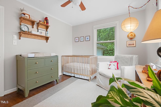 729 Mial St, Raleigh, NC 27608 - bedroom featuring dark wood-style flooring, ornamental molding, and ceiling fan