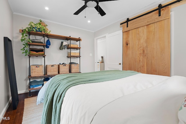 729 Mial St, Raleigh, NC 27608 - bedroom featuring wood finished floors, a barn door, baseboards, ornamental molding, and recessed lighting