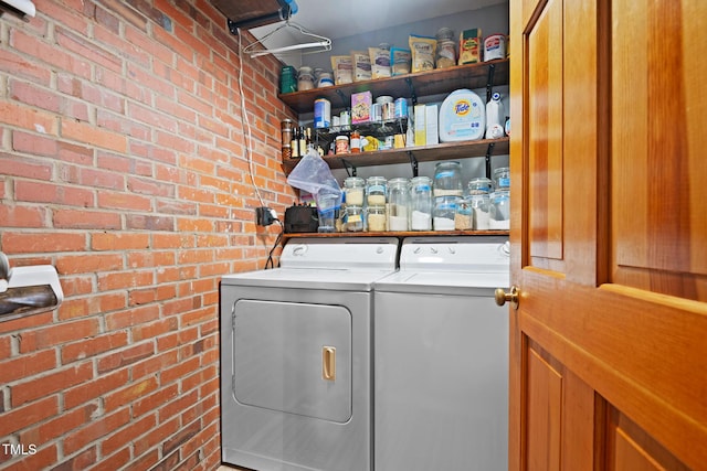 729 Mial St, Raleigh, NC 27608 - washroom featuring washer and clothes dryer and brick wall