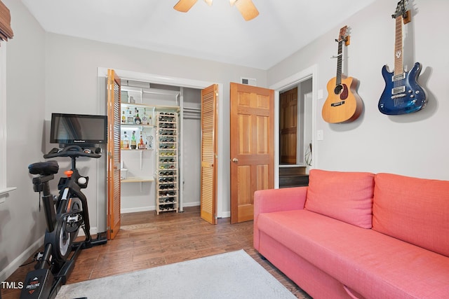 729 Mial St, Raleigh, NC 27608 - living area with wood finished floors, baseboards, and a ceiling fan