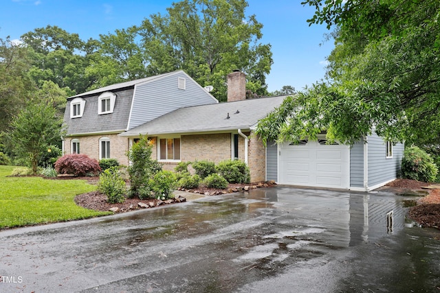 2805 Friendship Rd, Durham, NC 27705 - dutch colonial featuring a garage, a chimney, asphalt driveway, brick siding, and roof with shingles
