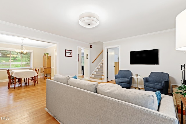 2805 Friendship Rd, Durham, NC 27705 - living room featuring light wood-style flooring, stairway, a chandelier, crown molding, and baseboards