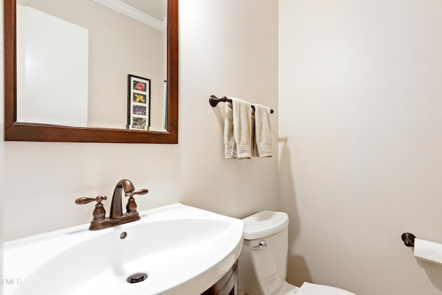 2805 Friendship Rd, Durham, NC 27705 - half bath featuring toilet, vanity, and ornamental molding