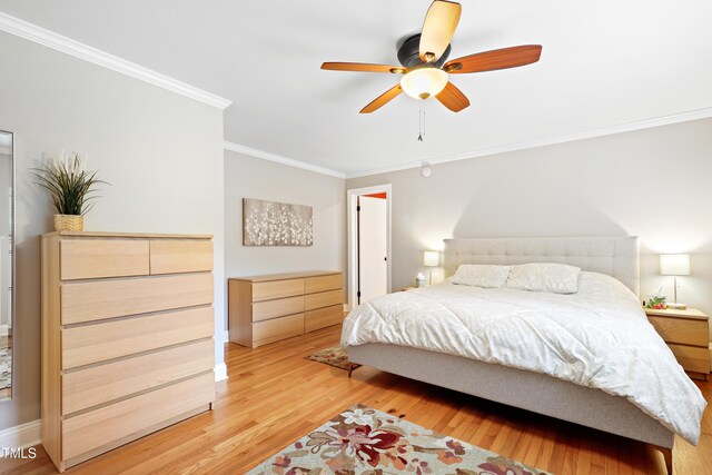 2805 Friendship Rd, Durham, NC 27705 - bedroom featuring crown molding, light wood-style flooring, and a ceiling fan