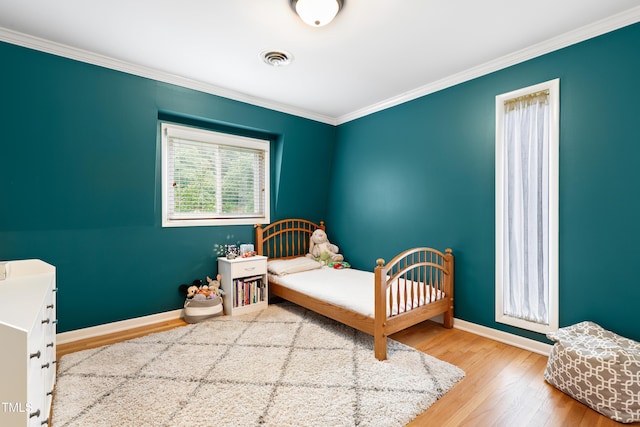 2805 Friendship Rd, Durham, NC 27705 - bedroom featuring baseboards, wood finished floors, and crown molding
