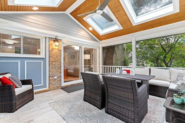 2805 Friendship Rd, Durham, NC 27705 - sunroom with a skylight, lofted ceiling, an outdoor hangout area, a ceiling fan, and outdoor dining space