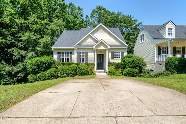 106 Gumdrop Path, Apex, NC 27502 - view of front facade with a front lawn and covered porch