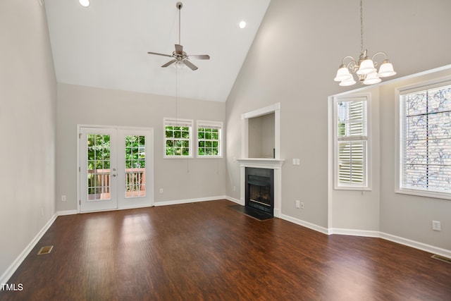 106 Gumdrop Path, Apex, NC 27502 - unfurnished living room with a chandelier, high vaulted ceiling, dark wood finished floors, a fireplace with flush hearth, and a ceiling fan