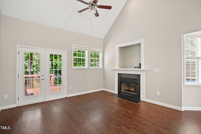 106 Gumdrop Path, Apex, NC 27502 - unfurnished living room featuring ceiling fan, a fireplace with flush hearth, wood finished floors, plenty of natural light, and high vaulted ceiling