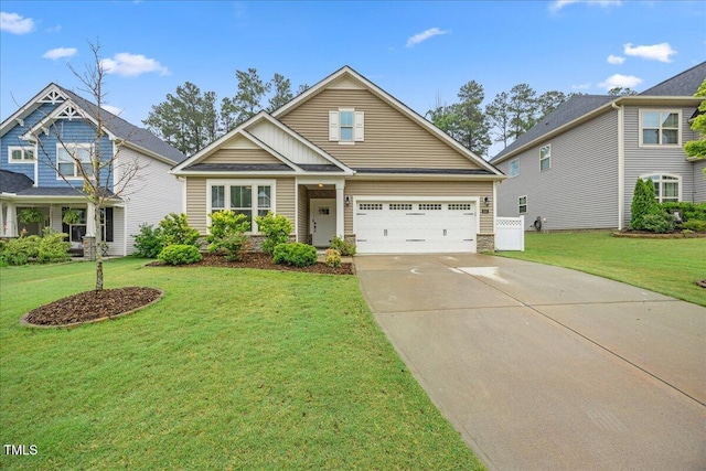 247 Axis Deer Ln, Garner, NC 27529 - view of front facade featuring concrete driveway and a front lawn