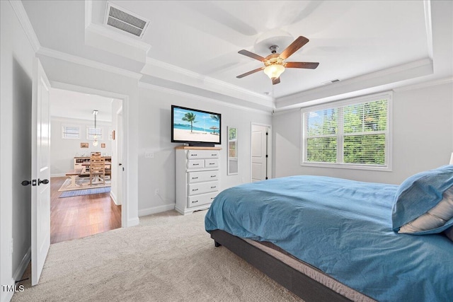 247 Axis Deer Ln, Garner, NC 27529 - bedroom featuring a raised ceiling, light carpet, crown molding, baseboards, and ceiling fan