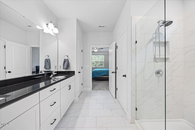 247 Axis Deer Ln, Garner, NC 27529 - ensuite bathroom featuring vanity, marble look tile flooring, a stall shower, baseboards, and a ceiling fan