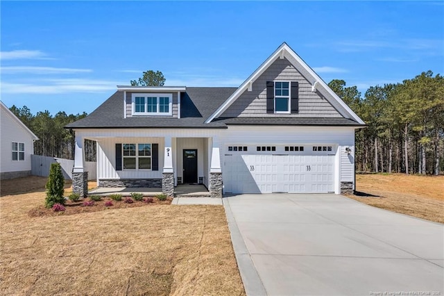 91 Laramie Ln, Selma, NC 27576 - craftsman-style house featuring a porch, concrete driveway, stone siding, roof with shingles, and an attached garage