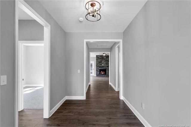 91 Laramie Ln, Selma, NC 27576 - hall with dark wood-style flooring, a chandelier, and baseboards