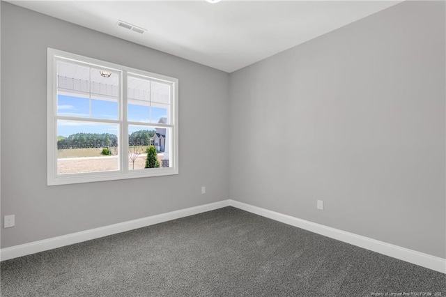 91 Laramie Ln, Selma, NC 27576 - unfurnished room with baseboards and dark colored carpet