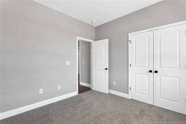 91 Laramie Ln, Selma, NC 27576 - unfurnished bedroom with carpet floors, a closet, and baseboards