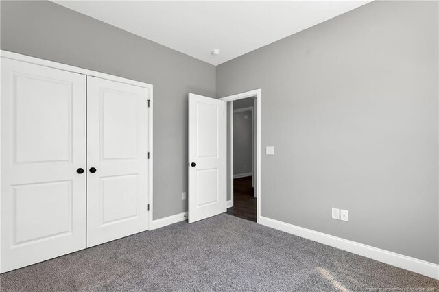 91 Laramie Ln, Selma, NC 27576 - unfurnished bedroom featuring carpet floors, baseboards, and a closet