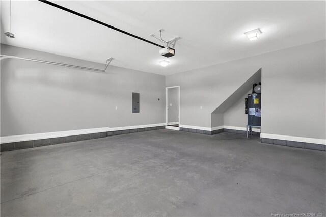 91 Laramie Ln, Selma, NC 27576 - garage with electric water heater, electric panel, a garage door opener, and baseboards