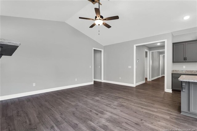 91 Laramie Ln, Selma, NC 27576 - unfurnished living room featuring a ceiling fan, vaulted ceiling, dark wood finished floors, baseboards, and recessed lighting