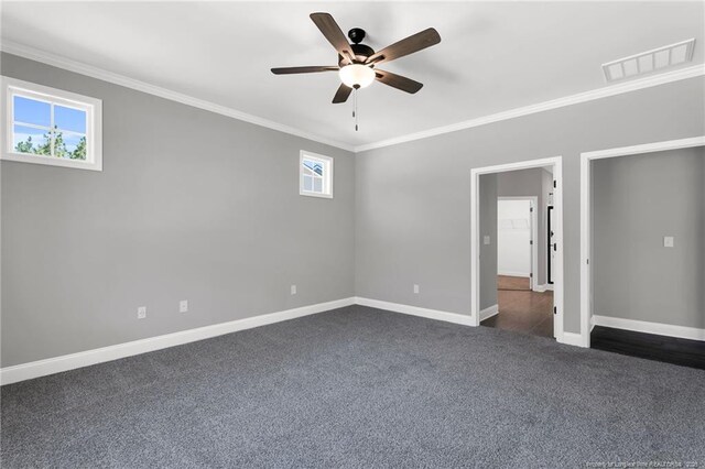 91 Laramie Ln, Selma, NC 27576 - unfurnished room with crown molding, dark carpet, ceiling fan, and baseboards