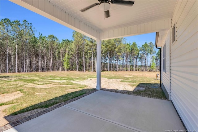 91 Laramie Ln, Selma, NC 27576 - view of patio with a ceiling fan and a wooded view
