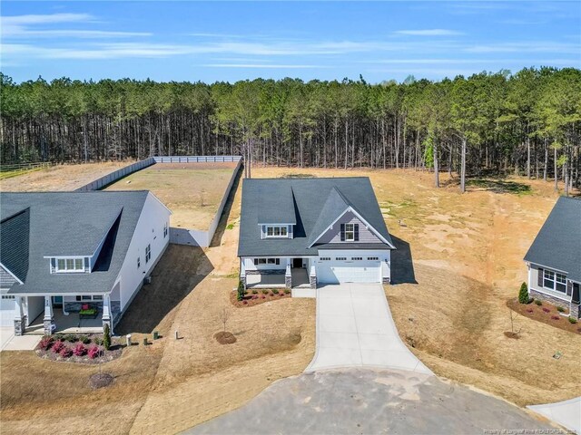91 Laramie Ln, Selma, NC 27576 - aerial view of property and surrounding area featuring a forest