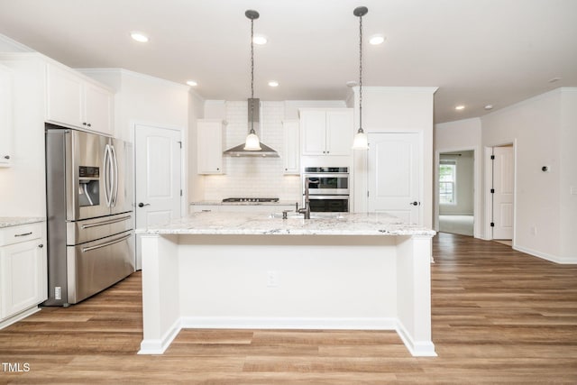 2619 Bordwell Grant Dr, New Hill, NC 27562 - kitchen featuring appliances with stainless steel finishes, wall chimney range hood, ornamental molding, backsplash, and a kitchen island with sink