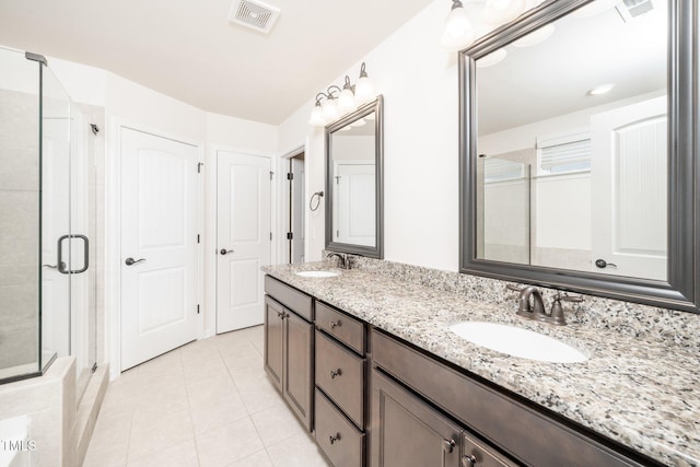 2619 Bordwell Grant Dr, New Hill, NC 27562 - full bath with double vanity, a stall shower, and tile patterned flooring