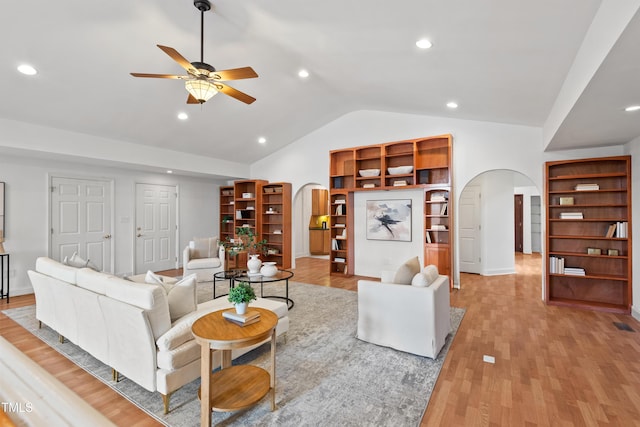 307 Country Club Dr, Durham, NC 27712 - living area with arched walkways, vaulted ceiling, ceiling fan, light wood-style floors, and recessed lighting