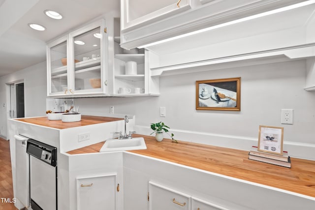 307 Country Club Dr, Durham, NC 27712 - kitchen with a sink, white cabinetry, glass insert cabinets, dishwasher, and recessed lighting