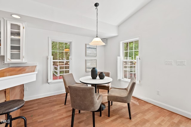 307 Country Club Dr, Durham, NC 27712 - dining area featuring light wood finished floors, baseboards, and lofted ceiling