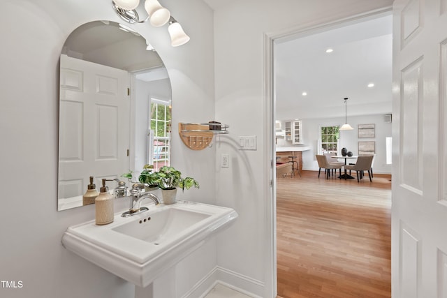 307 Country Club Dr, Durham, NC 27712 - bathroom featuring plenty of natural light, wood finished floors, recessed lighting, and baseboards