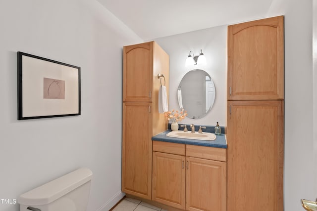 307 Country Club Dr, Durham, NC 27712 - bathroom with vanity, toilet, and tile patterned flooring