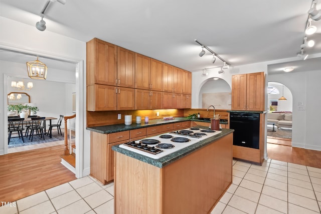 307 Country Club Dr, Durham, NC 27712 - kitchen featuring track lighting, dishwasher, arched walkways, and white electric cooktop