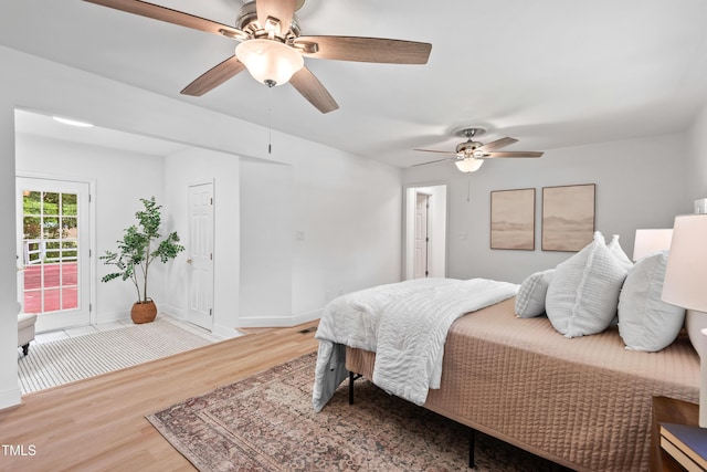 307 Country Club Dr, Durham, NC 27712 - bedroom with wood finished floors, baseboards, ceiling fan, and access to outside