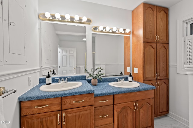 307 Country Club Dr, Durham, NC 27712 - bathroom featuring double vanity and marble finish flooring