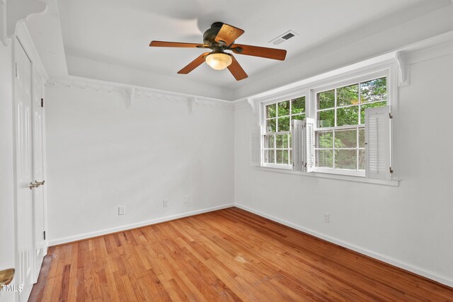 307 Country Club Dr, Durham, NC 27712 - empty room featuring light wood-type flooring, a ceiling fan, and baseboards