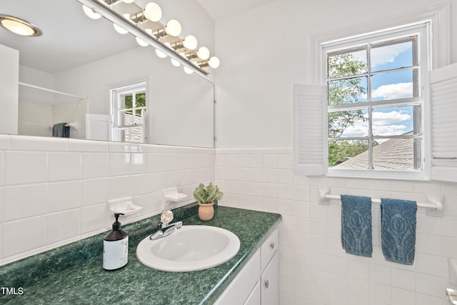307 Country Club Dr, Durham, NC 27712 - full bath with vanity, a shower, tile walls, and a wainscoted wall