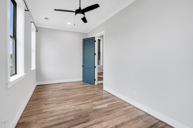 606 Velma Hopkins Ln, Raleigh, NC 27603 - spare room with light wood finished floors, baseboards, ornamental molding, ceiling fan, and recessed lighting