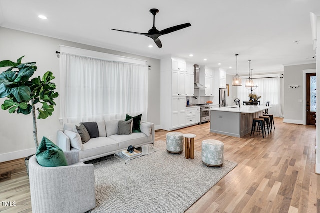 606 Velma Hopkins Ln, Raleigh, NC 27603 - living area with ceiling fan, recessed lighting, light wood-style floors, and baseboards