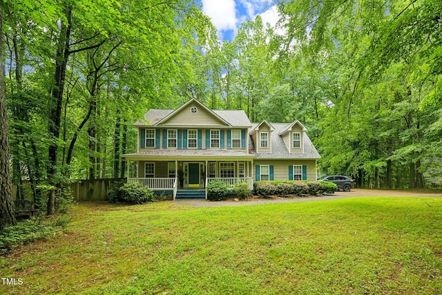 115 Redbay Ln, Clayton, NC 27527 - colonial house featuring a porch and a front lawn