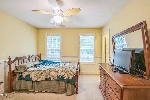 115 Redbay Ln, Clayton, NC 27527 - bedroom with a wainscoted wall, light colored carpet, a textured ceiling, and ceiling fan