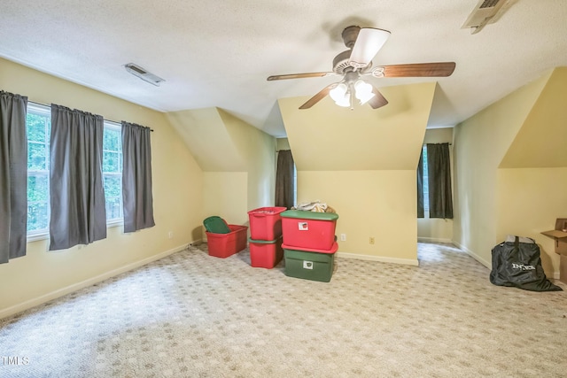 115 Redbay Ln, Clayton, NC 27527 - game room with lofted ceiling, carpet, a textured ceiling, baseboards, and a ceiling fan