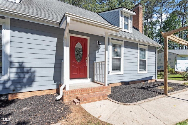 111 Mcdole Cir, Cary, NC 27511 - property entrance with a chimney, a shingled roof, and crawl space